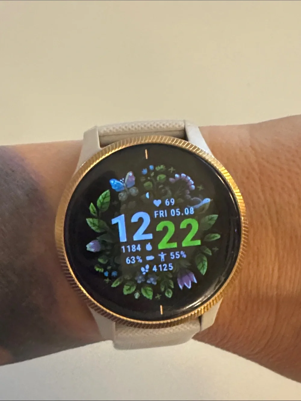 Garmin Venu Smartwatch with tan/cream Strap and rose gold Bezel